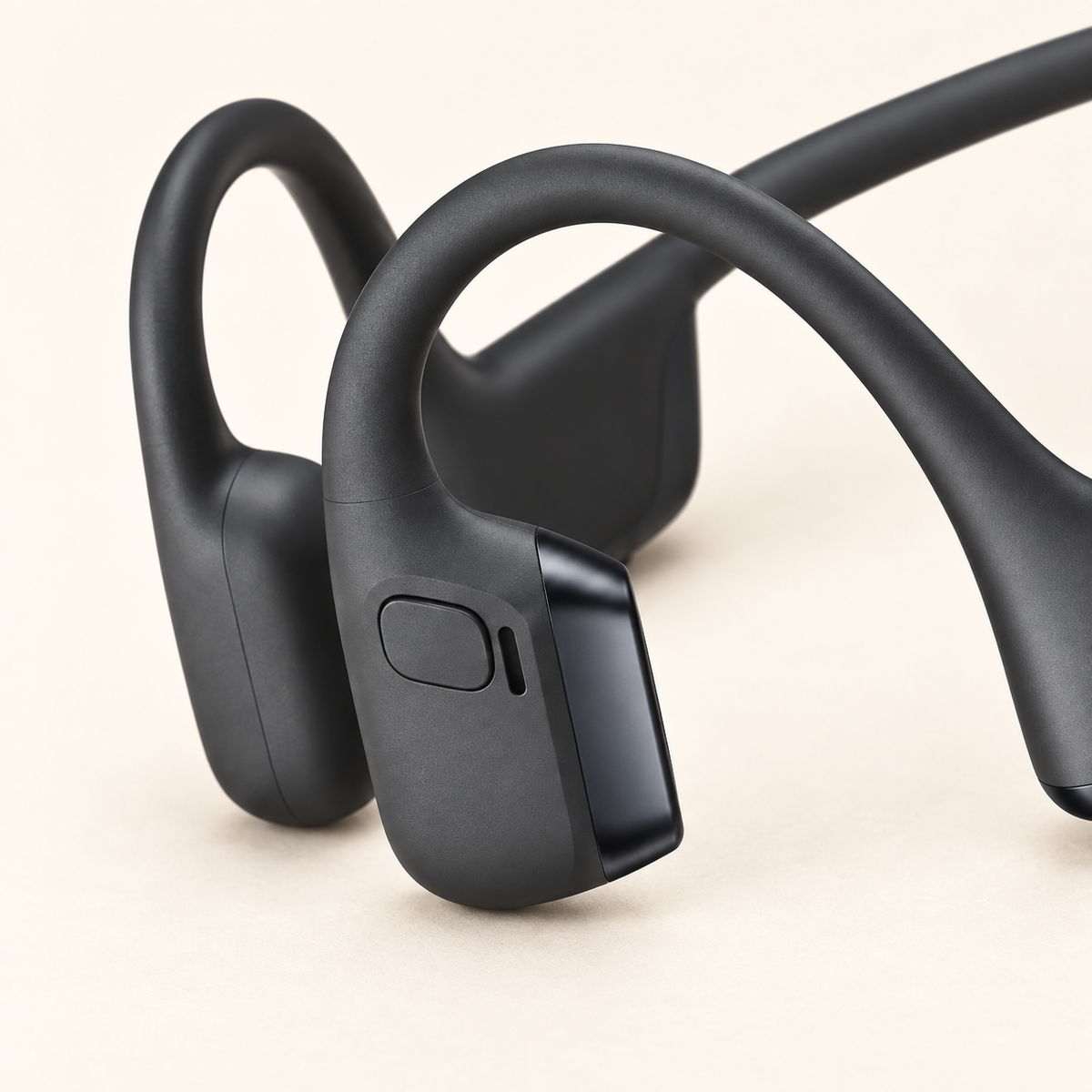 SHOKZ OpenRun Pro 2 physical control button and adjacent slit detail.