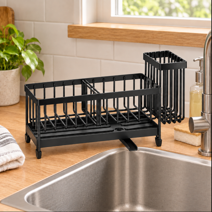 Sink caddy at the sink edge with spout aimed toward the basin.